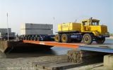 Concrete storage  units loaded on barge